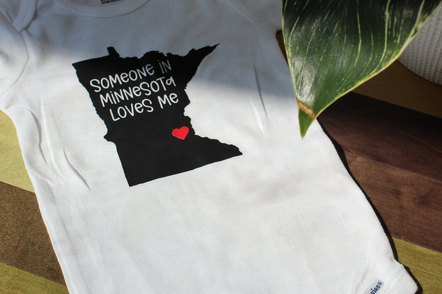 Someone in {State} Loves Me” Baby Onesie® | Personalized State Baby Bodysuit